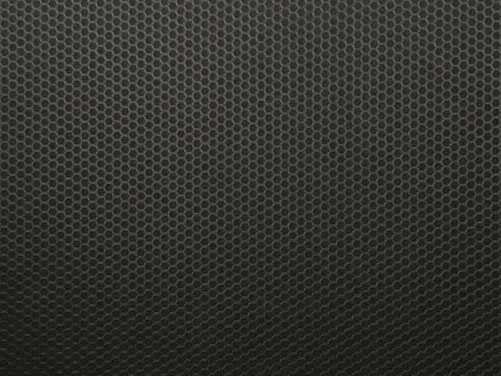 Close-up swatch of 3M Matrix Black wrap film, a black surface covered in a fine honeycomb texture