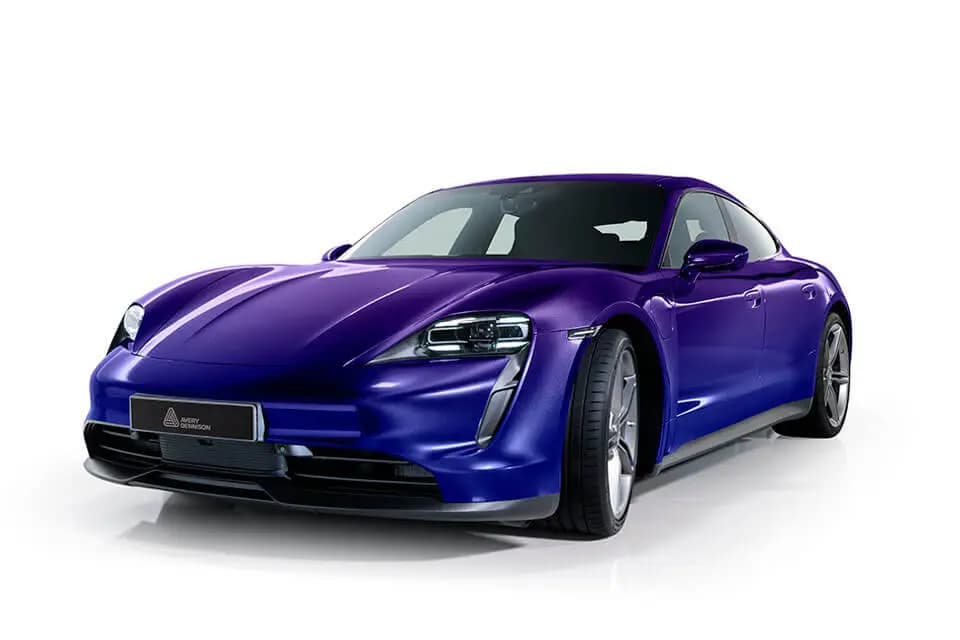 Avery Dennison studio photo of a Porsche Taycan sedan wrapped in Mysterious Indigo, shot against a plain white background